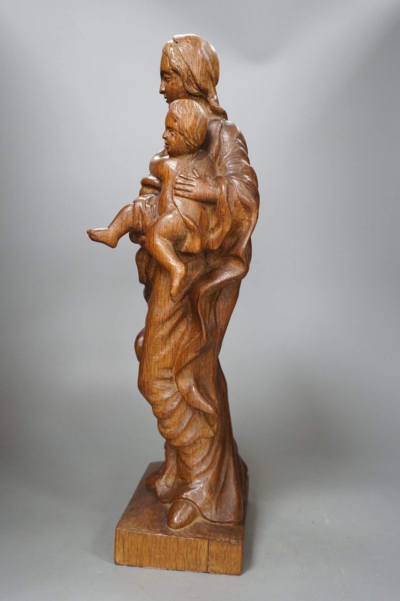 A 19th century carved oak Madonna and child, 49cm